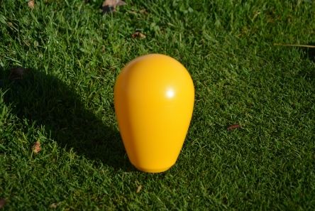 yellow pear shape plastic golf tee marker